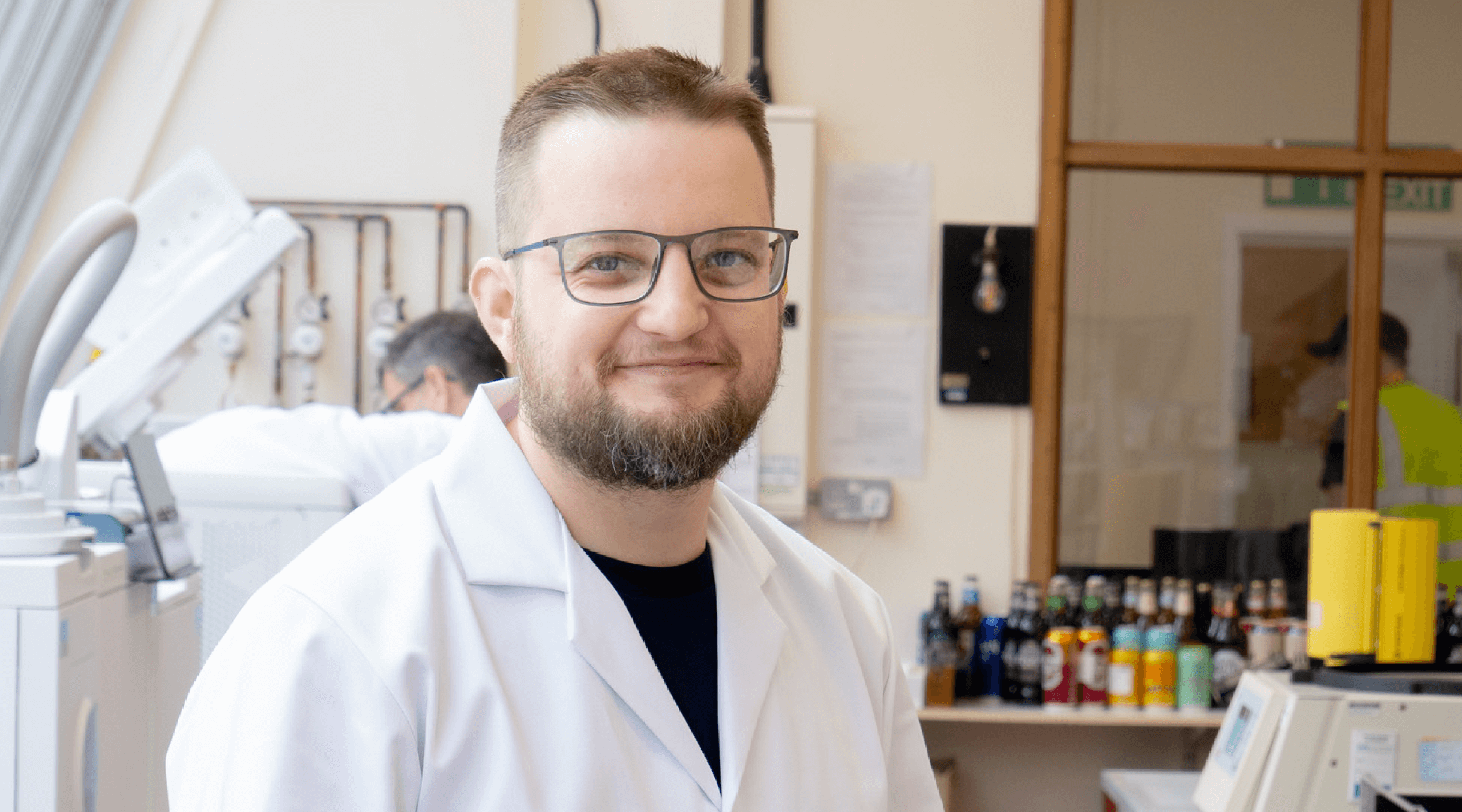 A person in a lab testing Greene King beers